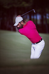 Image showing golfer hitting a sand bunker shot