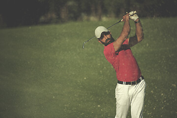 Image showing golfer hitting a sand bunker shot