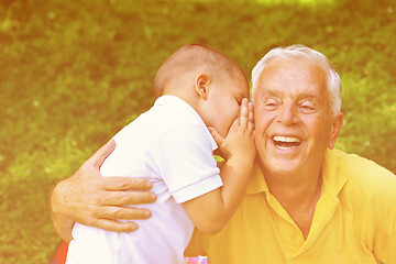 Image showing happy grandfather and child in park