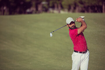 Image showing golfer hitting a sand bunker shot