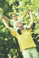 Image showing grandfather and child have fun  in park