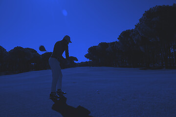 Image showing golf player hitting shot