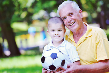 Image showing happy grandfather and child in park