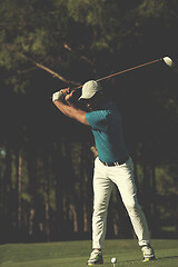 Image showing golf player hitting shot