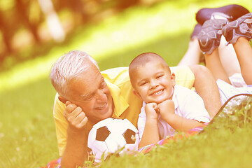 Image showing happy grandfather and child in park