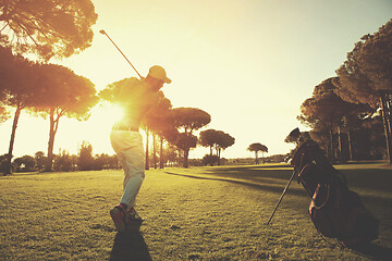 Image showing golf player hitting shot with club