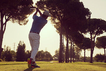 Image showing golf player hitting shot