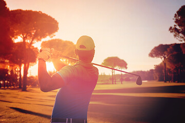 Image showing golf player hitting shot with club