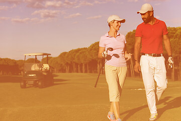 Image showing couple walking on golf course