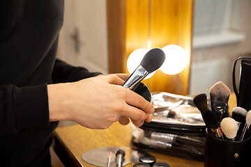 Image showing Professional makeup artist working at salon