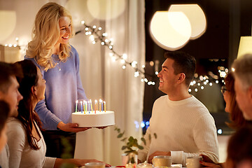 Image showing happy family with cake having birthday party