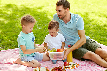 Image showing happy family having picnic at summer park