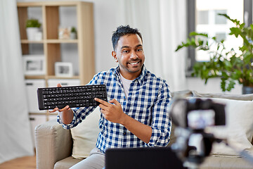 Image showing male video blogger with keyboard videoblogging