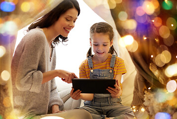 Image showing family with tablet pc in kids tent at home