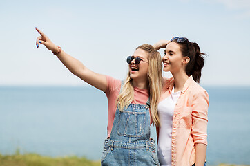 Image showing teenage girls or best friends at seaside in summer