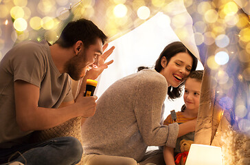 Image showing father telling scary stories to his daughter