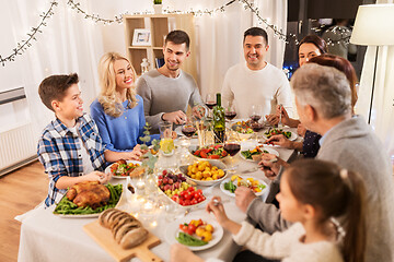 Image showing happy family having dinner party at home