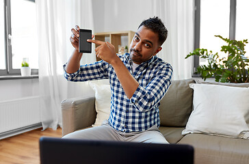 Image showing male blogger with smartphone videoblogging