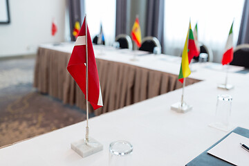 Image showing flags at international conference boardroom