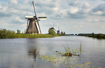 Image showing Windmill beside a canal