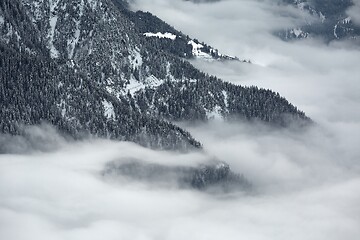 Image showing Mountain winter landscape above clouds