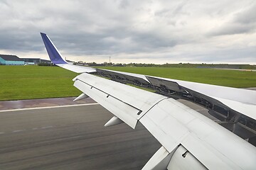 Image showing Landing plane wing flaps and spoilers extended