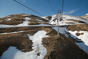Image showing Ski lift at a ski resort with little snow