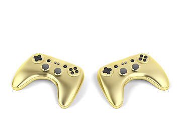 Image showing Two golden game controllers