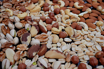 Image showing Various Nuts on Dark Blue Deck