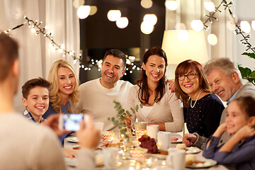 Image showing family having tea party and photographing at home