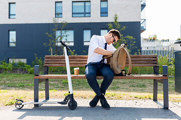 Image showing businessman with bag, scooter and coffee in city