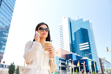 Image showing asian woman calling on smartphone in city