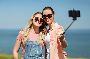 Image showing teenage girls or friends taking selfie in summer