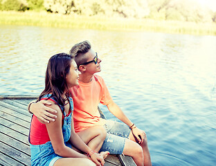 Image showing happy teenage couple hugging on river berth
