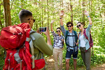 Image showing friends with backpacks being photographed on hike