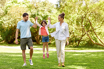 Image showing happy family walking in summer park