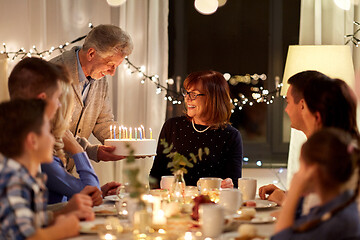 Image showing happy family with cake having birthday party