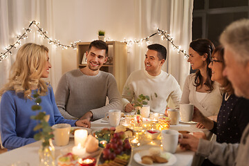 Image showing happy family having tea party at home