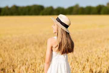 Image showing portrait of girl in straw hat on field in summer