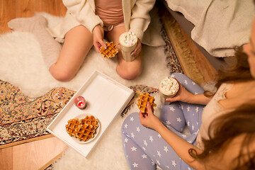 Image showing women drinking hot chocolate and eating waffles