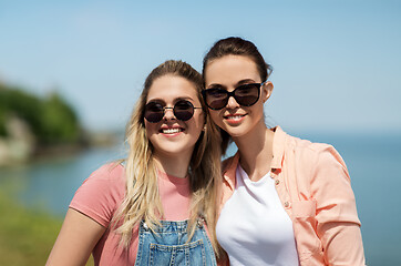 Image showing teenage girls or best friends at seaside in summer