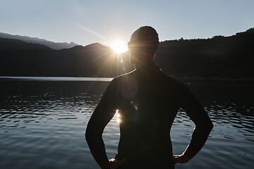 Image showing triathlon athlete starting swimming training on lake