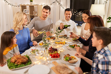 Image showing happy family having dinner party at home