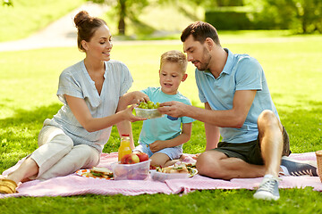 Image showing happy family having picnic at summer park