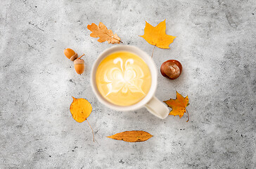 Image showing cup of coffee, autumn leaves, acorns and chestnut