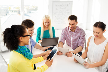 Image showing creative team with table computers in office