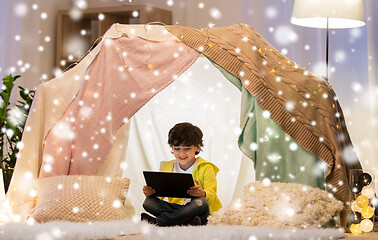 Image showing little boy with tablet pc in kids tent at home