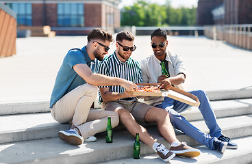 Image showing male friends eating pizza with beer on street