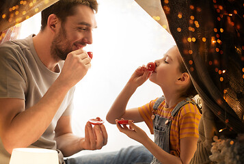 Image showing family playing tea party in kids tent at home