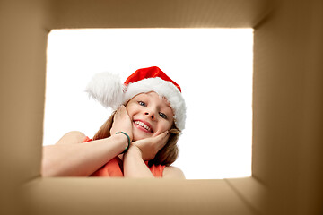 Image showing amazed girl looking into christmas gift box